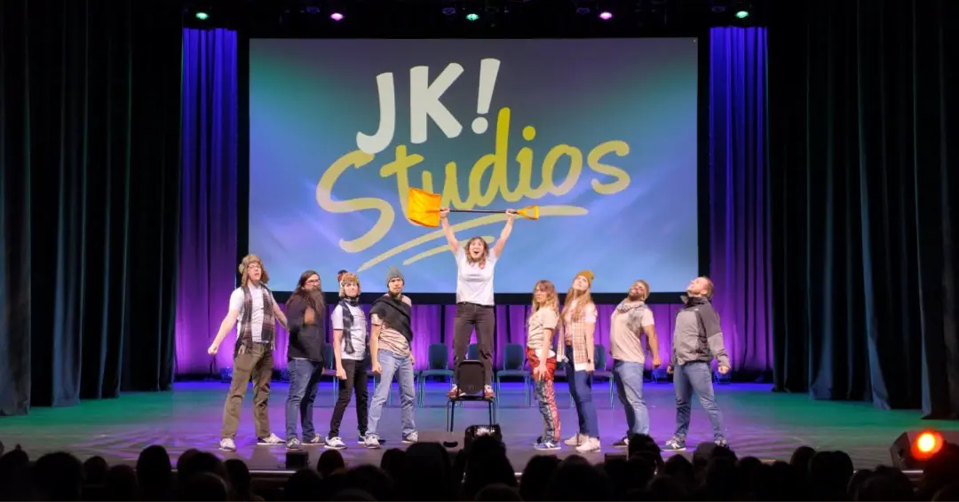 JK! Studios cast on stage